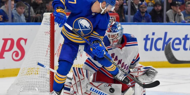 Igor Shesterkin stops the shot of Jason Zucker (17) for one of his 37 saves in the Rangers' 4-0 road win over the Sabres on Oct. 9, 2025.