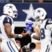 Cowboys players Dak Prescott (4) and CeeDee Lamb (88) greet each other on the field.
