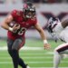 Tampa Bay Buccaneers tight end Cade Otton (88) runs with the ball after a recpetion as Houston Texans safety Jalen Pitre (5) attempts to make a tackle during the fourth quarter at NRG Stadium.