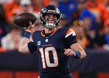 Denver Broncos quarterback Bo Nix (10) throws a football.