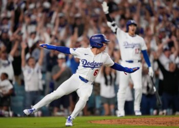 Los Angeles Dodgers' Hyeseong Kim reacts after scoring the game-winning run against the Phillies.