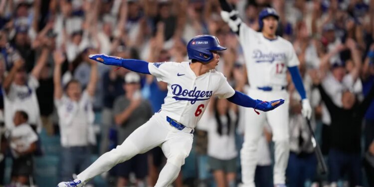Los Angeles Dodgers' Hyeseong Kim reacts after scoring the game-winning run against the Phillies.