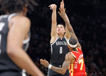 Egor Demin #8 of the Brooklyn Nets puts up a shot over Nickeil Alexander-Walker #7 of the Atlanta Hawks during the first half when the Brooklyn Nets played the Atlanta Hawks Wednesday, October 29, 2025 at Barclays Center in Brooklyn, NY.