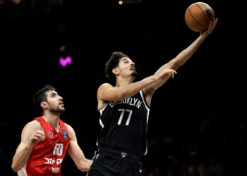 Ben Saraf goes up for a shot after driving past Yovel Zoosman during the Nets' 123-88 round over Hapoel Jerusalem at Barclays Center on Oct. 4, 2025.