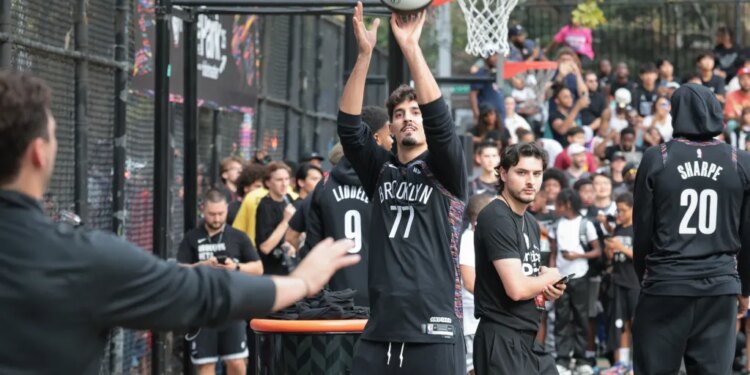 Brooklyn Nets player Ben Saraf takes a shot during practice.