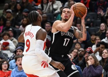 Michael Porter Jr., who scored a game-high 34 point, looks to make a move on RJ Barrett during the Nets' 119-114 loss to the Raptors in their preseason finale on Oct. 17, 2025.