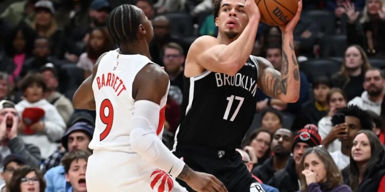 Michael Porter Jr., who scored a game-high 34 point, looks to make a move on RJ Barrett during the Nets' 119-114 loss to the Raptors in their preseason finale on Oct. 17, 2025.