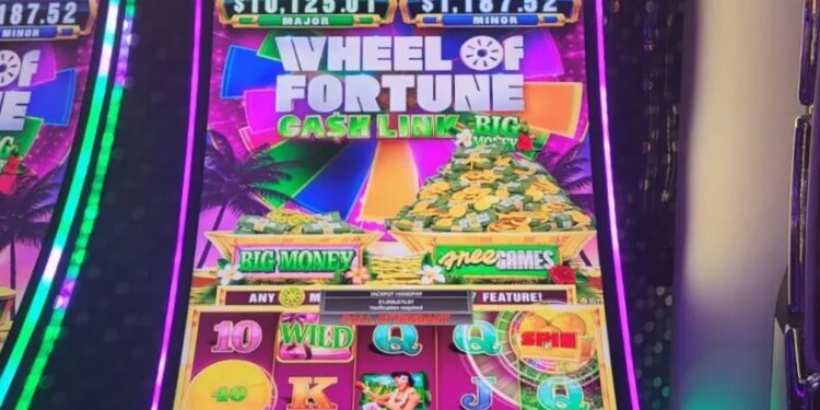 Wheel of Fortune slot machine showing a jackpot of $1,048,675.87.