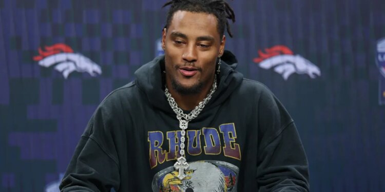 Denver Broncos linebacker Nik Bonitto responds to a question during a news conference after defeating the New York Jets in an NFL football game Sunday, Oct. 12, 2025, in London.