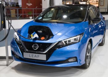 Blue Nissan Leaf e+ Tekna electric car charging at Automobile Barcelona 2021.
