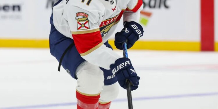 Florida Panthers right wing Mackie Samoskevich (11) controls the puck.