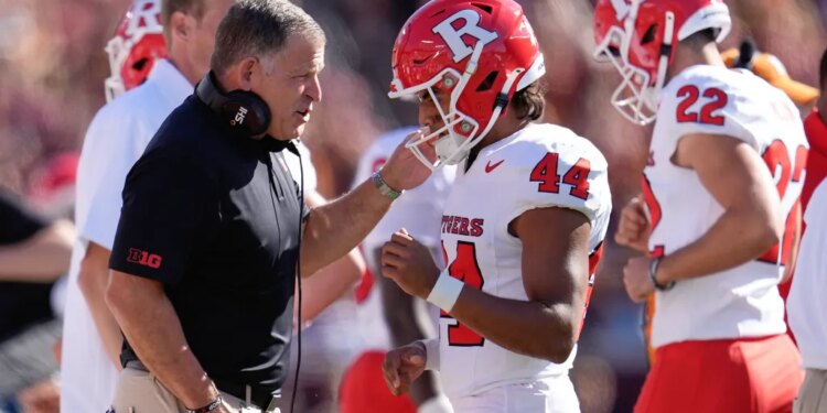 Rutgers head coach Greg Schiano talks with place kicker Jai Patel (44) after he missed a field goal.