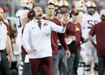 Minnesota head coach PJ Fleck shouts to his team during a game.