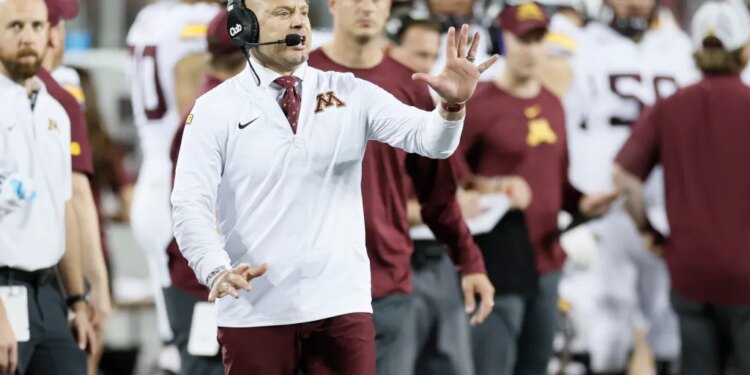 Minnesota head coach PJ Fleck shouts to his team during a game.