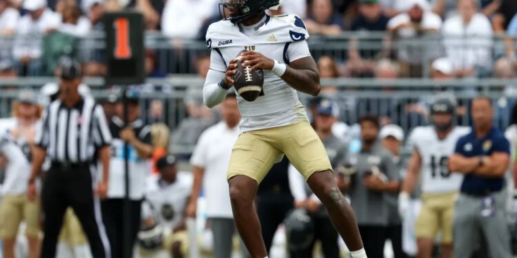 Florida International Panthers quarterback Keyone Jenkins (1) dropping back in the pocket.