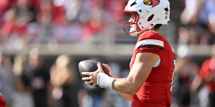 Louisville Cardinals quarterback Miller Moss (7) looks to pass.