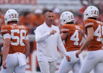 Coach Pete Kwiatkowski speaks to Sam Houston St Texas football players.