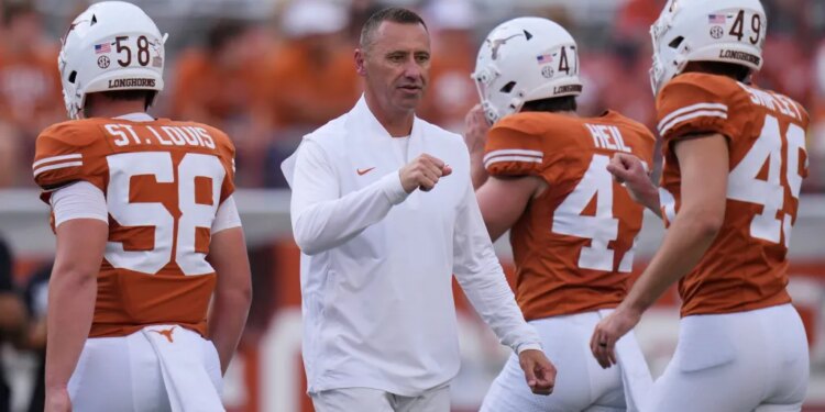 Coach Pete Kwiatkowski speaks to Sam Houston St Texas football players.