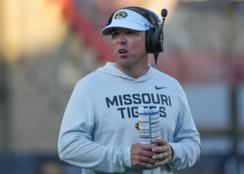 Missouri Tigers head coach Eli Drinkwitz on the field during the first half of a game.