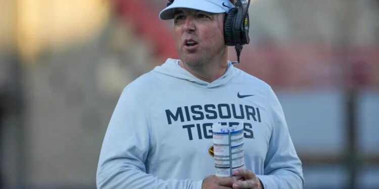 Missouri Tigers head coach Eli Drinkwitz on the field during the first half of a game.