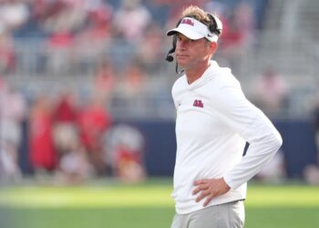 Mississippi head coach Lane Kiffin looking downfield at his team.