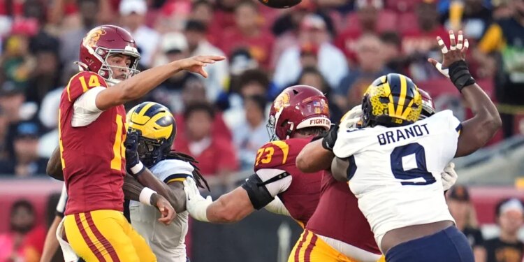 Southern California quarterback Jayden Maiava (14) throws under pressure.