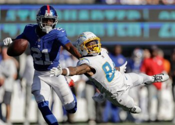 Cornerback Paulson Adebo, who will be facing his old team, the Saints, on Sunday, breaks up a pass intended for Keandre Lambert-Smith during the Giants' Week 4 win over the Chargers.