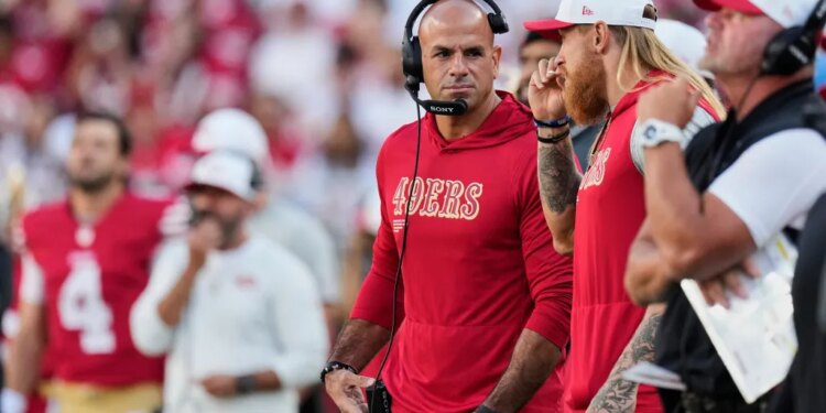 Robert Saleh and George Kittle on the sideline.