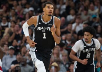 Jeremy Sochan of the Spurs dribbling the basketball.