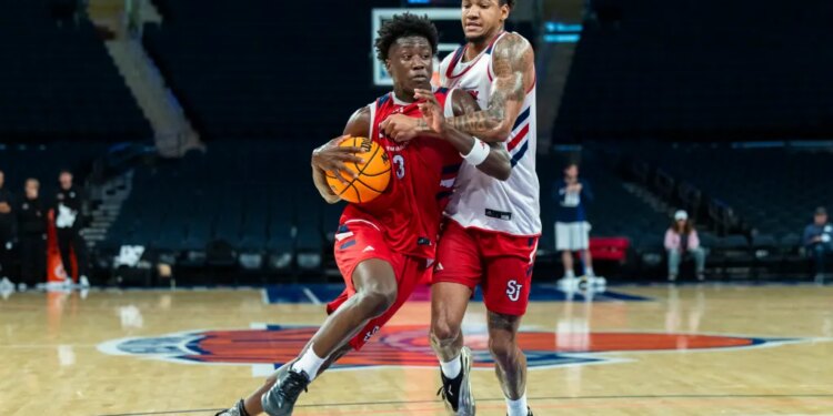 Joson Sanon drives around Dillon Mitchell during a St. John's scrimmage at Madison Square Garden on Oct. 8, 2025.