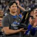 Shohei Ohtani holds the NLCS MVP trophy after the Dodgers' series-clinching Game 5 win over the Brewers.