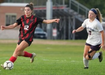 Jadyn Stadler of the Syosset girls soccer team works the ball upfield during a recent game.