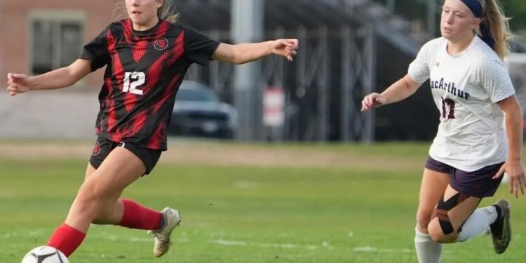 Jadyn Stadler of the Syosset girls soccer team works the ball upfield during a recent game.