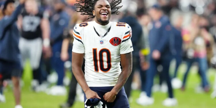 Darnell Mooney, number 10 for the Chicago Bears, celebrates on the field.