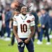 Darnell Mooney, number 10 for the Chicago Bears, celebrates on the field.