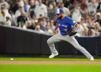 A ground ball hit by New York Yankees Ben Rice gets away from Toronto Blue Jays second baseman Isiah Kiner-Falefa during Game 3 of the ALDS on Oct. 7, 2025.
