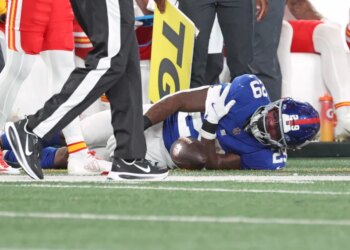 Tyrone Tracy Jr. grabs his shoulder in pain during the Giants-Chiefs game on Sept. 21, 2025.