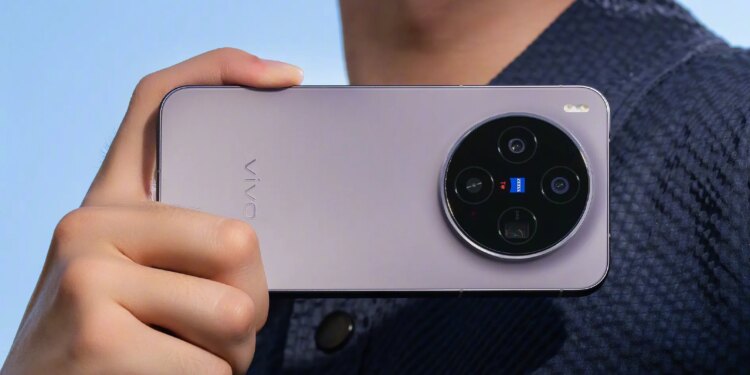 Purple Vivo X300 held horizontally by a man.