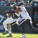 Philadelphia Eagles quarterback Jalen Hurts (1) is sacked by Denver Broncos linebacker Nik Bonitto (15).