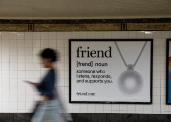 Photo of Friend ad in new york city subway as a blurred person walks past it.