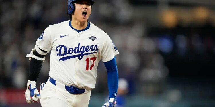 Los Angeles Dodgers player Shohei Ohtani yelling in excitement during a baseball game.