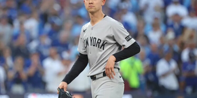 A dejected Luke Weaver walks to the dugout after being taken out of the game in the seventh inning of the Yankees' 10-1 blowout loss to the Blue Jays in Game 1 of the ALDS on Oct. 4, 2025.