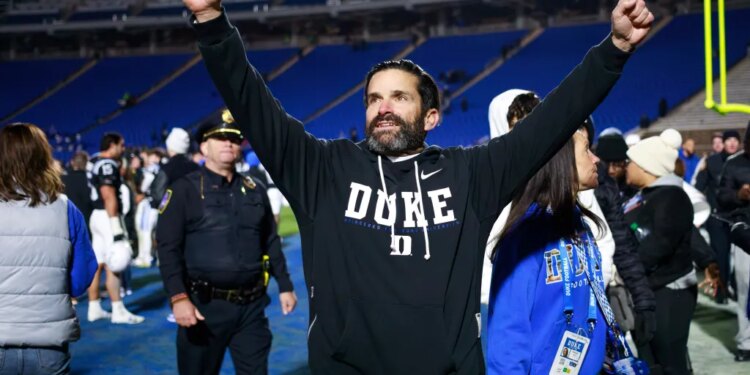 Duke head coach Manny Diaz celebrates his team's victory.