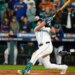 Seattle Mariners catcher Cal Raleigh hitting a solo home run against the Toronto Blue Jays.
