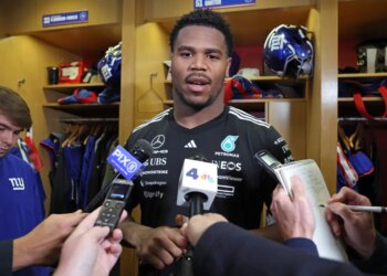 New York Giants linebacker Abdul Carter (51) speaks to the media in the locker room.