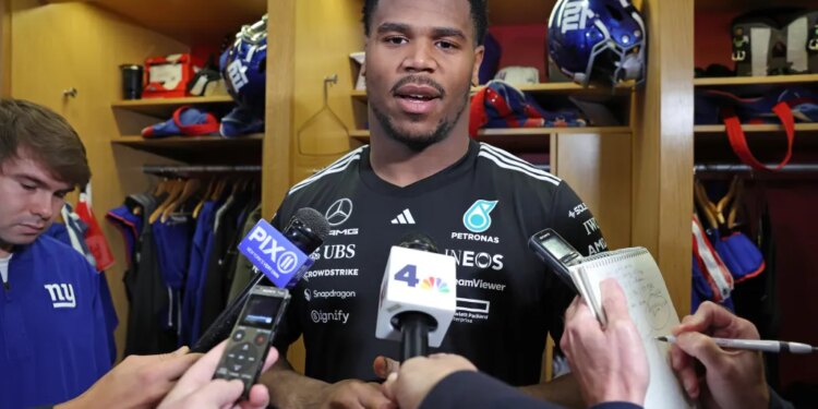New York Giants linebacker Abdul Carter (51) speaks to the media in the locker room.