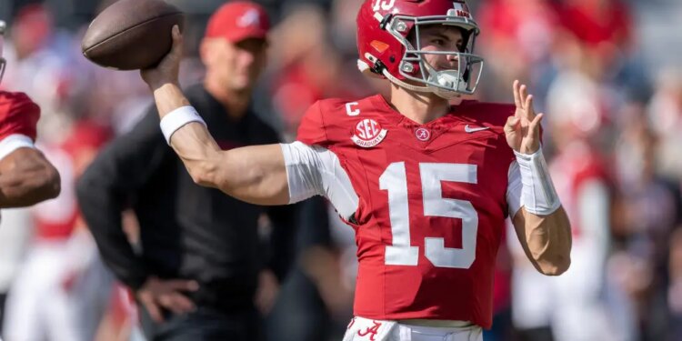 Alabama quarterback Ty Simpson (15) warms up before an NCAA college football game against Eastern Illinois.