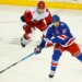 Rangers left wing Artemi Panarin (10) plays the puck against Carolina Hurricanes defenseman Sean Walker