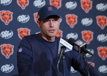 Chicago Bears coach Ben Johnson speaking at a press conference.