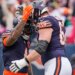 Two Chicago Bears football players high-fiving.